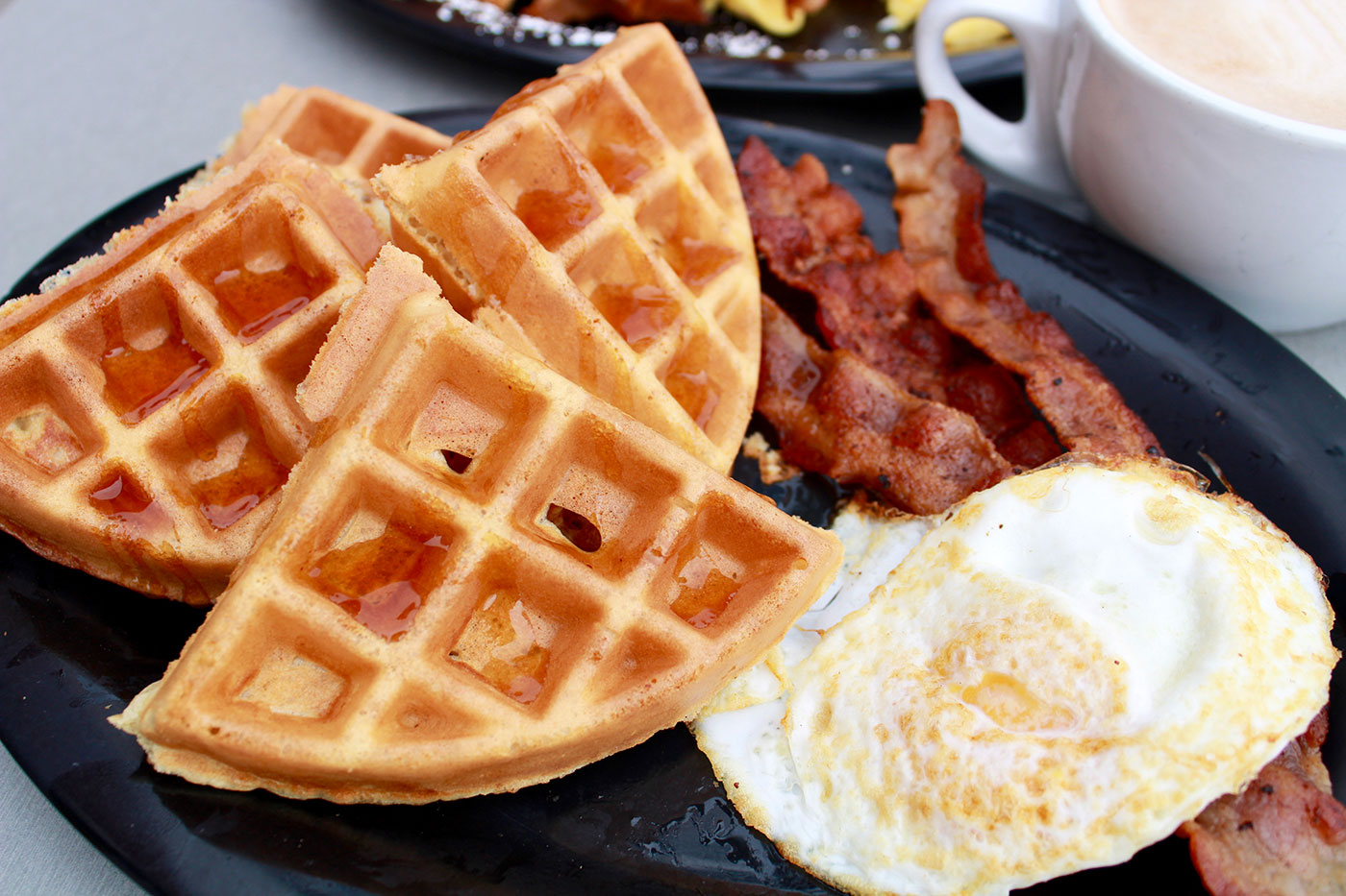 Waffles, eggs, and bacon from Rooster Cafe